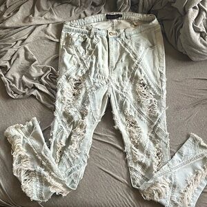 Distressed light blue jeans